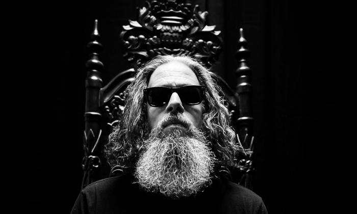 Jason Bieler poses in a black and white photo.